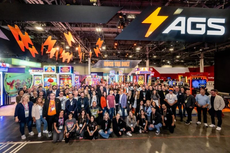 AGS staff members posing together at gaming industry event G2E